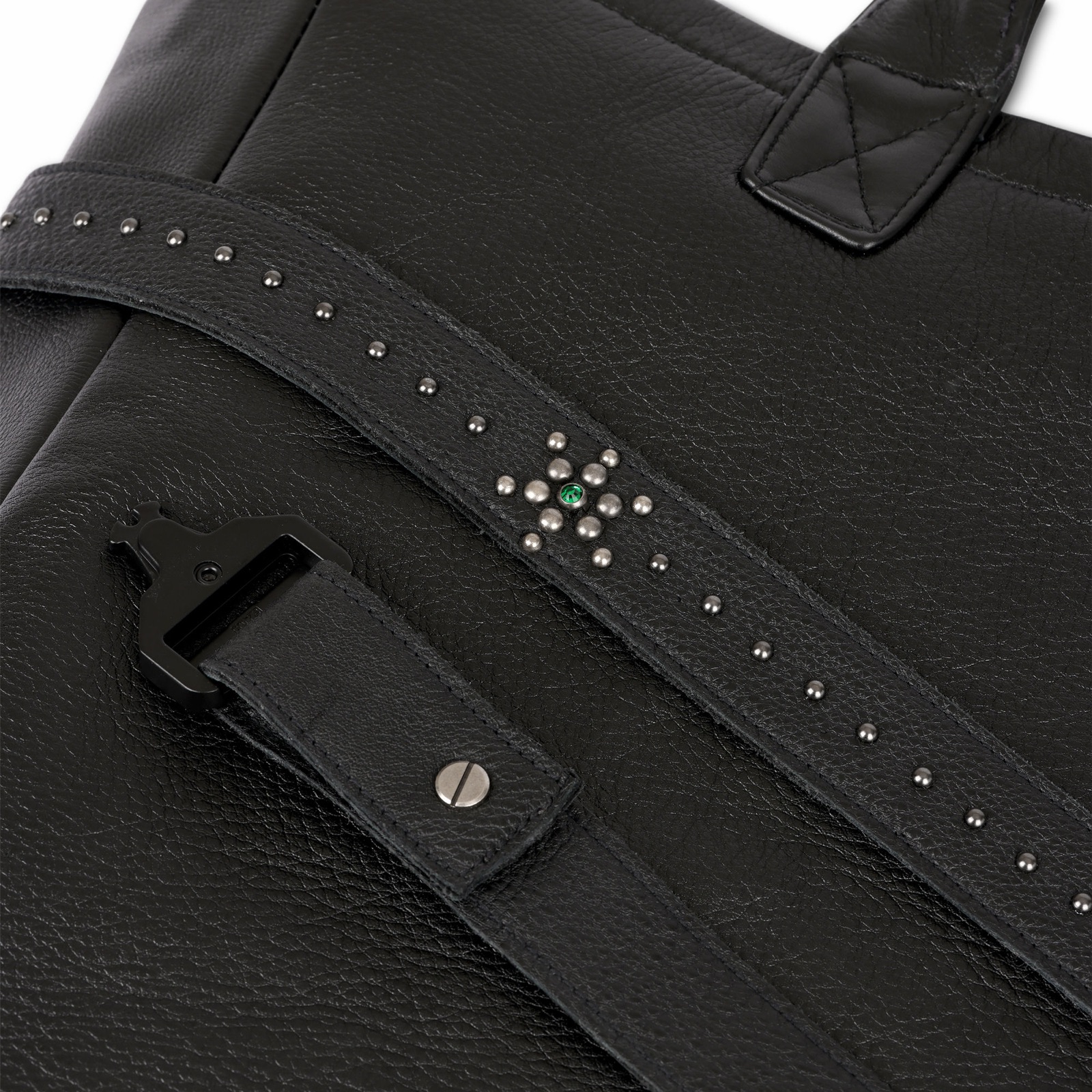 Studded compass-star strap detail with green stone